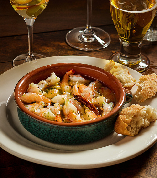 La Casa del Abuelo’s Gambas al Ajillo (Garlic Shrimp) highlighting food and family connection