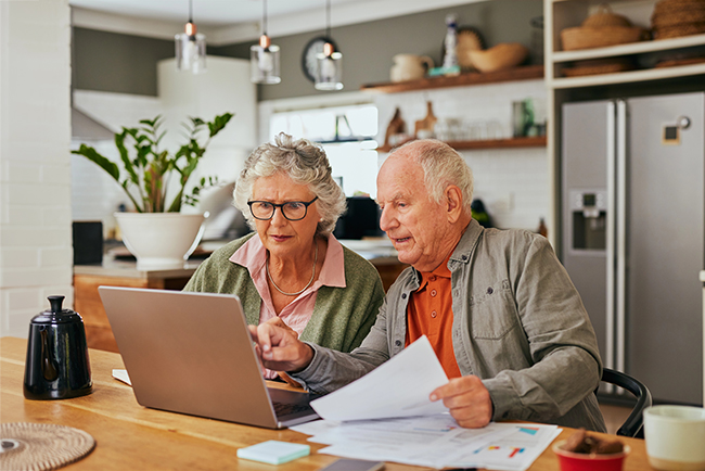 Older couple reviewing Medicare coverage options together at home